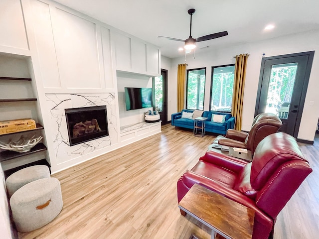 217 Cove Point Ln, Mccormick, SC 29835 - living area featuring light wood-style flooring, ceiling fan, a fireplace, and recessed lighting