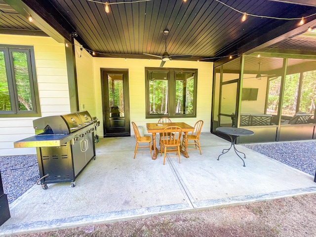 217 Cove Point Ln, Mccormick, SC 29835 - view of patio featuring ceiling fan, area for grilling, outdoor dining space, and a sunroom