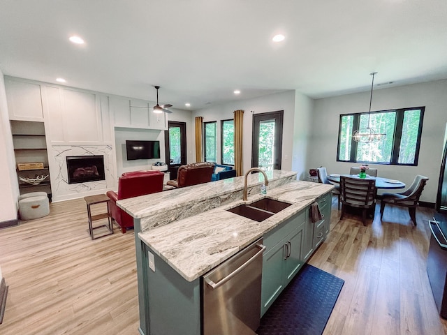 217 Cove Point Ln, Mccormick, SC 29835 - kitchen featuring a sink, dishwasher, recessed lighting, healthy amount of natural light, and a high end fireplace