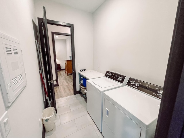 217 Cove Point Ln, Mccormick, SC 29835 - laundry area featuring independent washer and dryer and light tile patterned floors