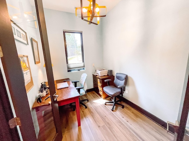 217 Cove Point Ln, Mccormick, SC 29835 - office area with a chandelier, light wood-style floors, and baseboards