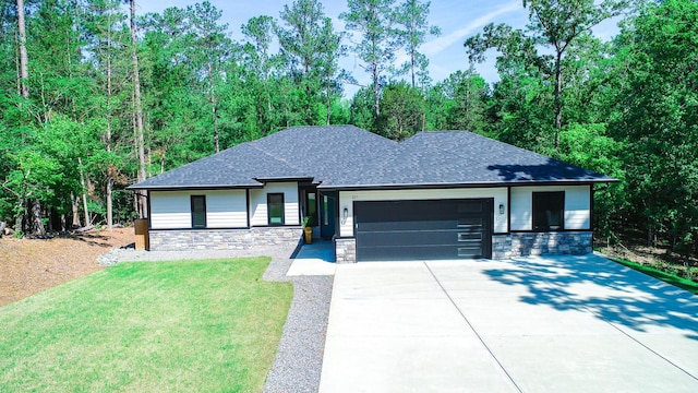 217 Cove Point Ln, Mccormick, SC 29835 - view of front of home featuring stone siding, driveway, an attached garage, a shingled roof, and a front yard