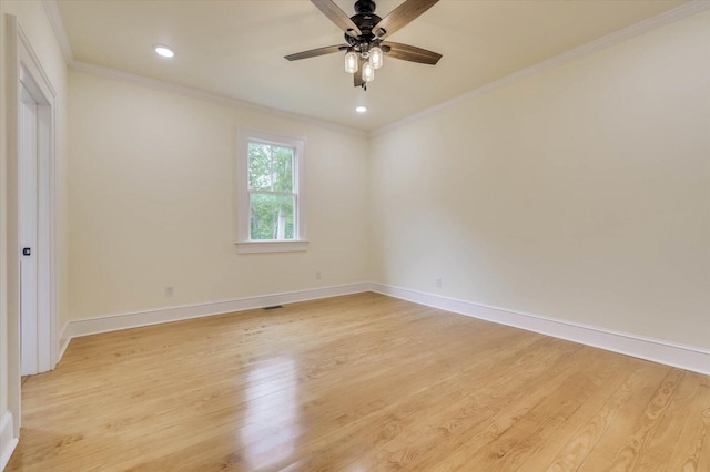 spare room featuring ornamental molding, ceiling fan, and light hardwood / wood-style floors