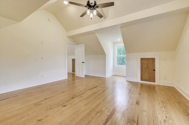 additional living space with vaulted ceiling, ceiling fan, and light hardwood / wood-style flooring