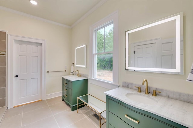 bathroom with crown molding, tile patterned floors, and vanity