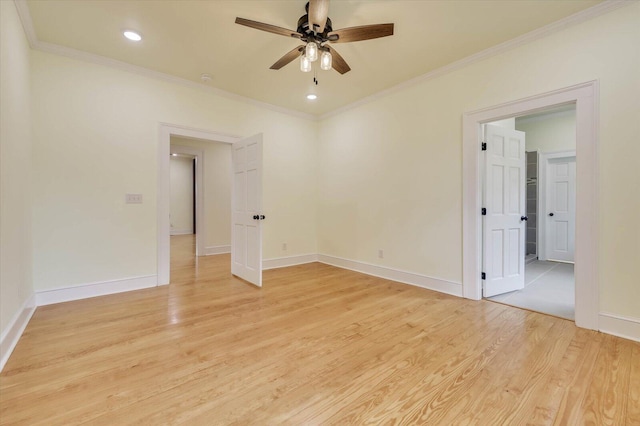 spare room with ornamental molding, light hardwood / wood-style floors, and ceiling fan