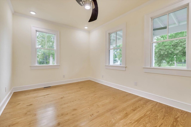 unfurnished room featuring crown molding and light hardwood / wood-style flooring