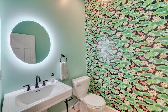 bathroom featuring sink and toilet