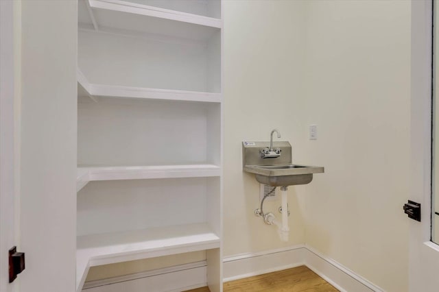 bathroom featuring sink and hardwood / wood-style floors