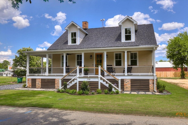 view of front of house featuring covered porch and a front yard