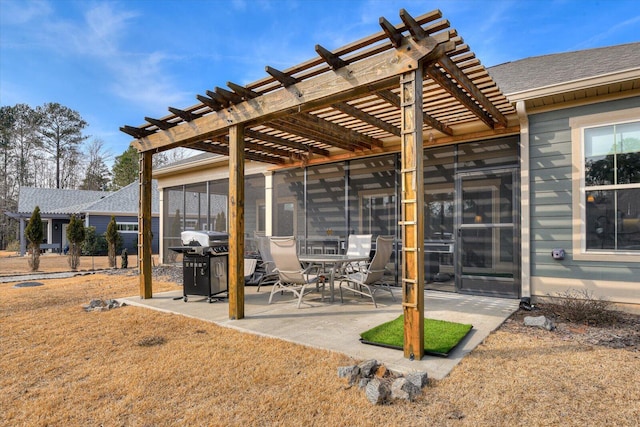 view of patio with grilling area, a pergola, and a sunroom