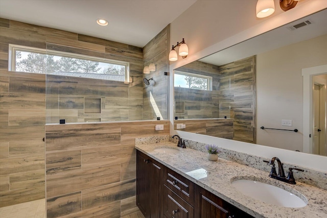 bathroom with plenty of natural light and vanity