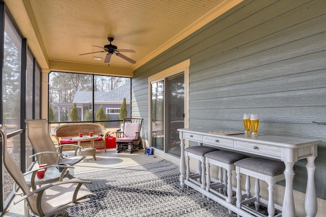 sunroom / solarium with ceiling fan