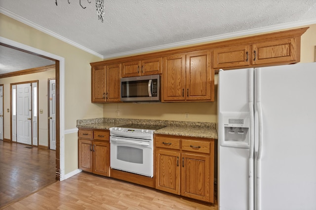 40 Driftwood Ct, Aiken, SC 29801 - kitchen featuring white appliances, brown cabinetry, light wood-style floors, ornamental molding, and a textured ceiling