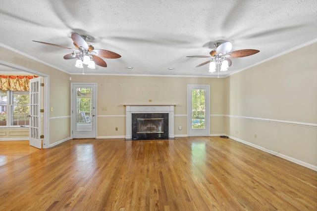 40 Driftwood Ct, Aiken, SC 29801 - unfurnished living room with a ceiling fan, plenty of natural light, a premium fireplace, ornamental molding, and a textured ceiling