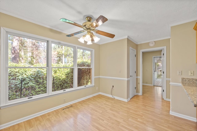 40 Driftwood Ct, Aiken, SC 29801 - spare room with light wood-type flooring, a textured ceiling, crown molding, ceiling fan, and baseboards
