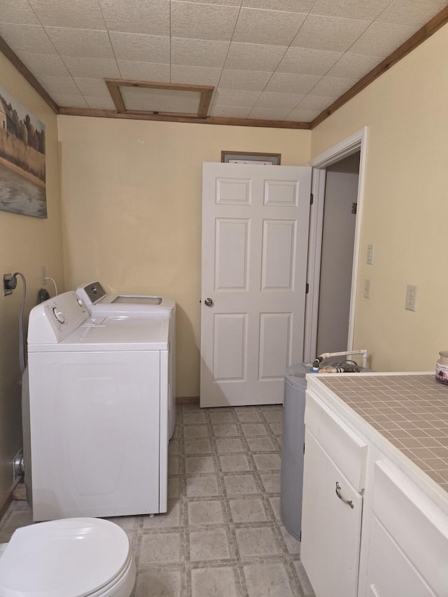 3706 Cooter Creek Rd, Elberton, GA 30635 - washroom featuring washing machine and clothes dryer, crown molding, and light floors
