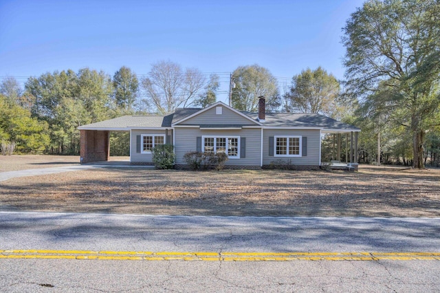 single story home with a carport