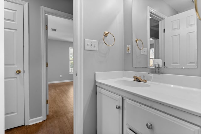 bathroom featuring vanity and wood-type flooring