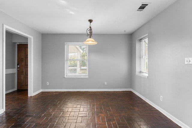 spare room with a wealth of natural light