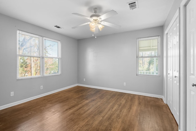 unfurnished bedroom with hardwood / wood-style floors and ceiling fan