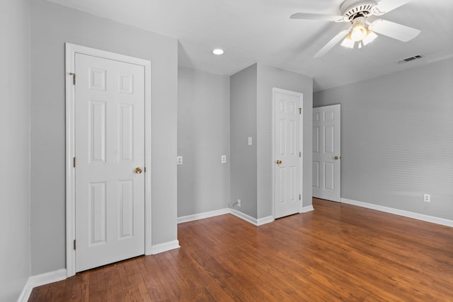 unfurnished bedroom with hardwood / wood-style floors and ceiling fan