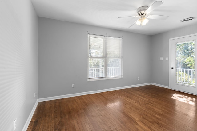 spare room with hardwood / wood-style floors and ceiling fan