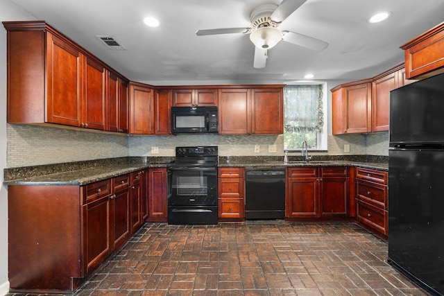 kitchen with decorative backsplash, dark stone counters, ceiling fan, sink, and black appliances