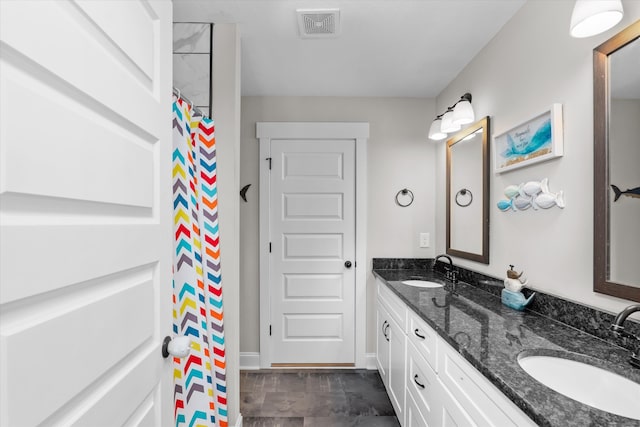 bathroom with vanity and walk in shower