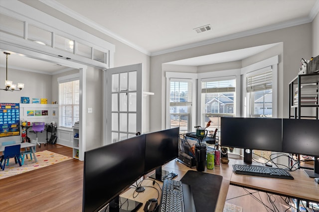 office space with ornamental molding, a chandelier, and hardwood / wood-style floors