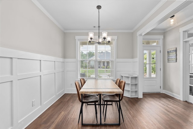 256 Dublin Loop, Grovetown, GA 30813 - dining room with a decorative wall, dark wood finished floors, crown molding, a chandelier, and a wainscoted wall