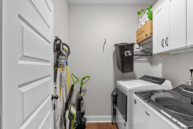256 Dublin Loop, Grovetown, GA 30813 - laundry area featuring washing machine and dryer, cabinet space, wood finished floors, and baseboards