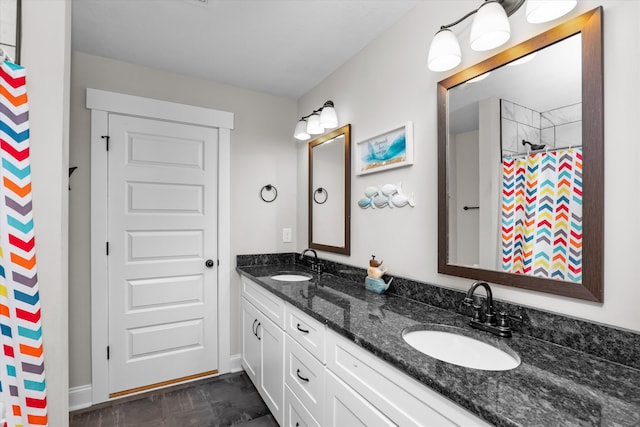 bathroom featuring vanity and curtained shower