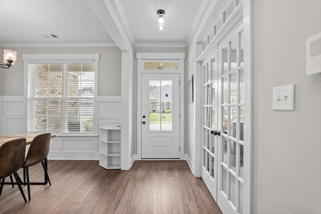 256 Dublin Loop, Grovetown, GA 30813 - entrance foyer with dark wood-type flooring, a decorative wall, healthy amount of natural light, ornamental molding, and a wainscoted wall