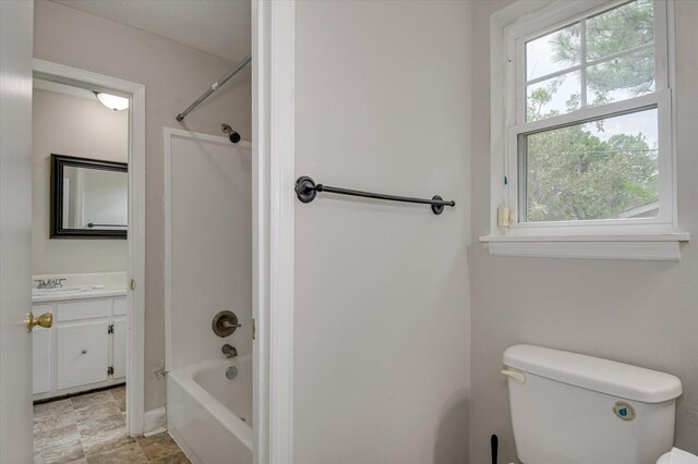 full bathroom with vanity,  shower combination, and toilet