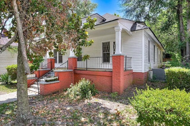 1107 Heard Ave, Augusta, GA 30904 - view of front facade with a porch, a shingled roof, and stairs
