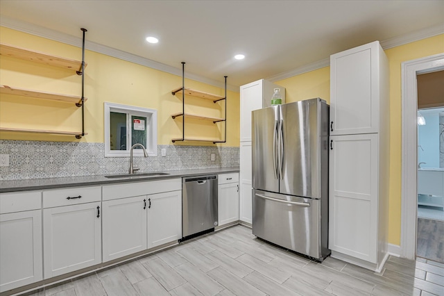 1107 Heard Ave, Augusta, GA 30904 - kitchen with open shelves, stainless steel appliances, ornamental molding, decorative backsplash, and white cabinetry