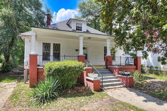 1107 Heard Ave, Augusta, GA 30904 - bungalow-style home with covered porch, a shingled roof, and a chimney