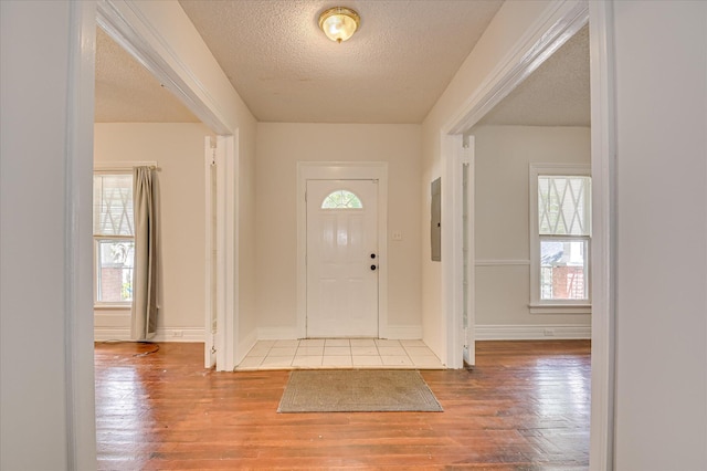 1107 Heard Ave, Augusta, GA 30904 - entrance foyer featuring hardwood / wood-style floors, healthy amount of natural light, a textured ceiling, and electric panel