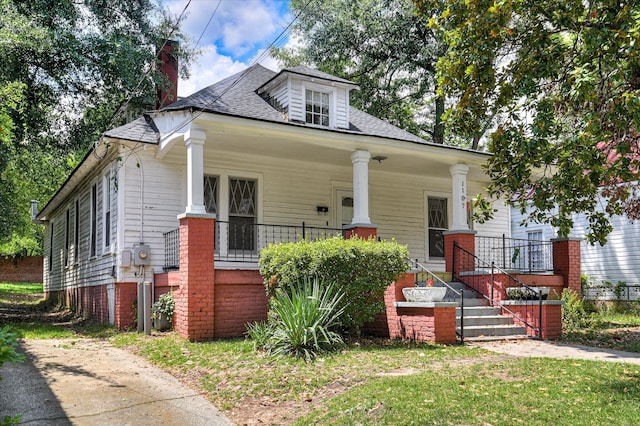 1107 Heard Ave, Augusta, GA 30904 - view of front of home featuring covered porch, a chimney, a shingled roof, and a front lawn