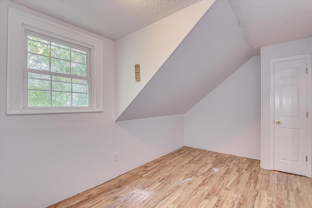 1107 Heard Ave, Augusta, GA 30904 - additional living space featuring wood finished floors, a textured ceiling, and lofted ceiling