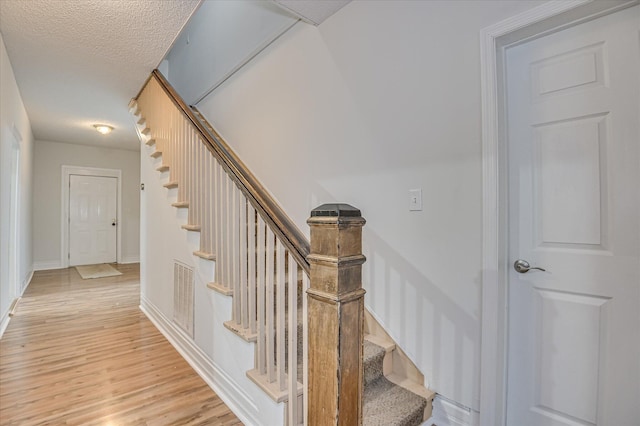 1107 Heard Ave, Augusta, GA 30904 - stairs featuring wood finished floors and baseboards