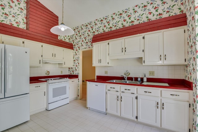 904 Big Hunt Rd, Augusta, GA 30907 - kitchen with white appliances, wallpapered walls, under cabinet range hood, dark countertops, and white cabinets