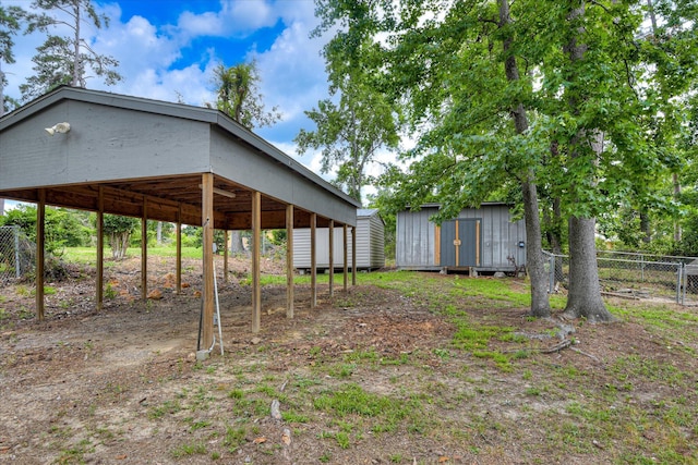 904 Big Hunt Rd, Augusta, GA 30907 - view of yard featuring a shed and a carport