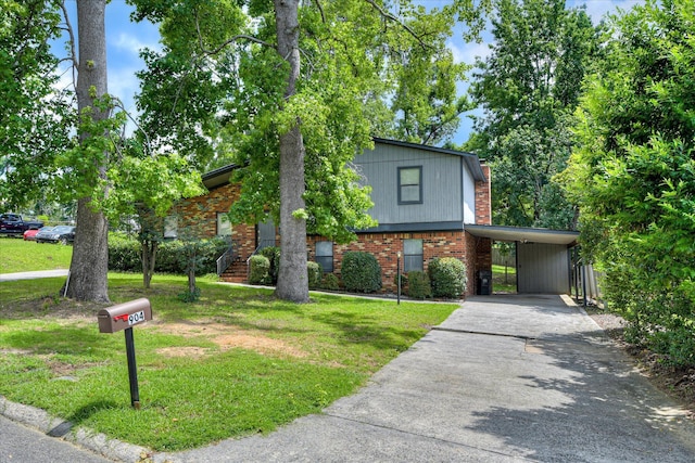 904 Big Hunt Rd, Augusta, GA 30907 - view of front of home featuring asphalt driveway, a front yard, brick siding, and a carport