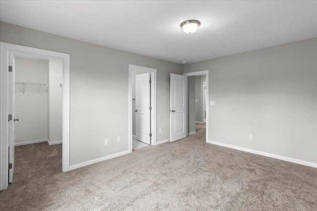 5511 Sweetwater Dr, Grovetown, GA 30813 - unfurnished bedroom with carpet, a spacious closet, and a closet