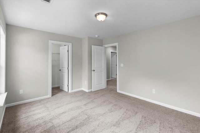 5511 Sweetwater Dr, Grovetown, GA 30813 - unfurnished bedroom with carpet, a walk in closet, and a closet