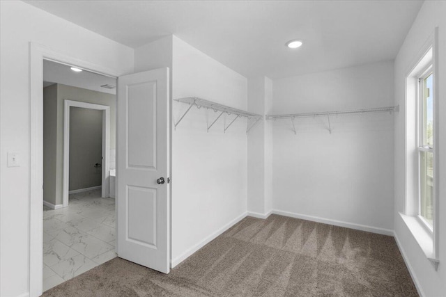 5511 Sweetwater Dr, Grovetown, GA 30813 - walk in closet with marble look tile flooring and carpet floors