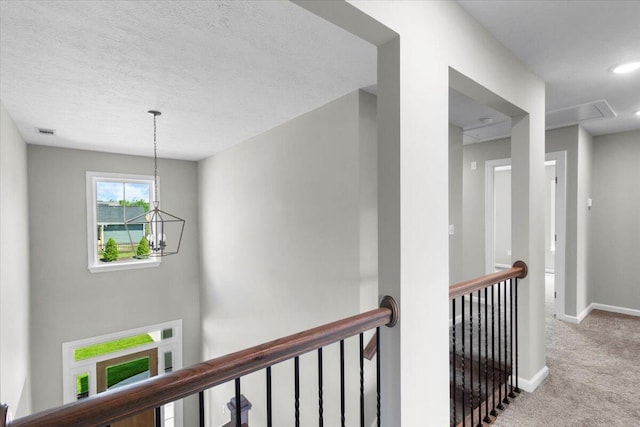5511 Sweetwater Dr, Grovetown, GA 30813 - hallway featuring an upstairs landing, carpet flooring, a chandelier, and a textured ceiling