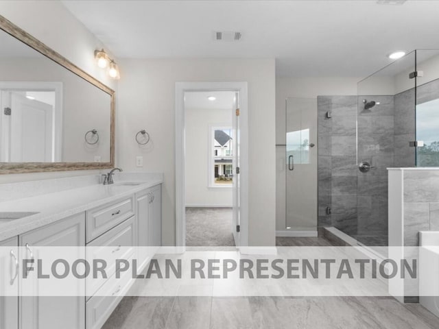 bathroom featuring vanity and a shower with shower door